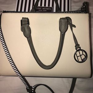 A cream Henri bendel creme purse with olive